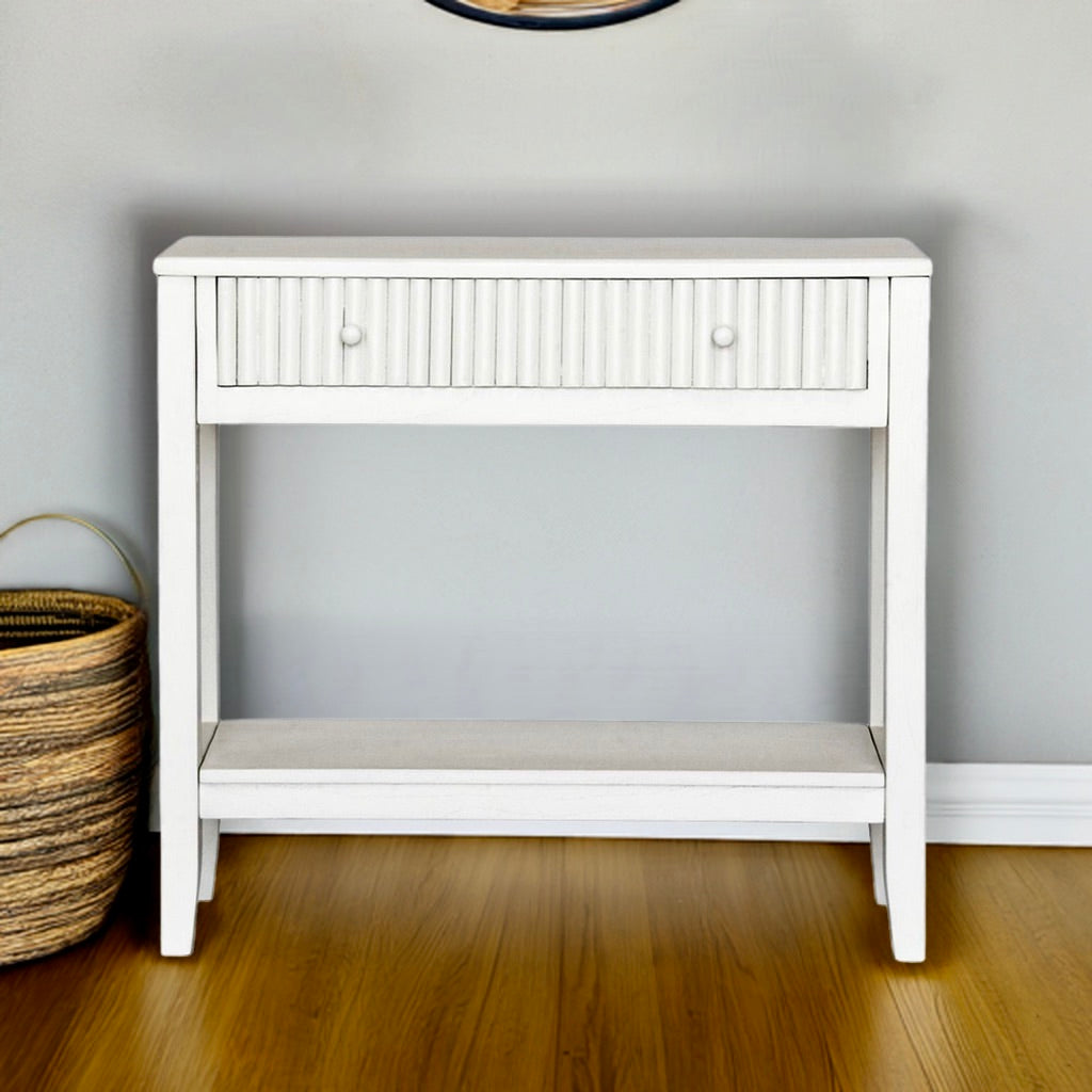 The Vienna - 1 Drawer White Console brings a contemporary feel with its sleek design and textured drawer face. Built with sustainable white cedar its 1-drawer sits on wooden runners. Colour white. Measures 800 length X 250 depth X 750 height. Styled.