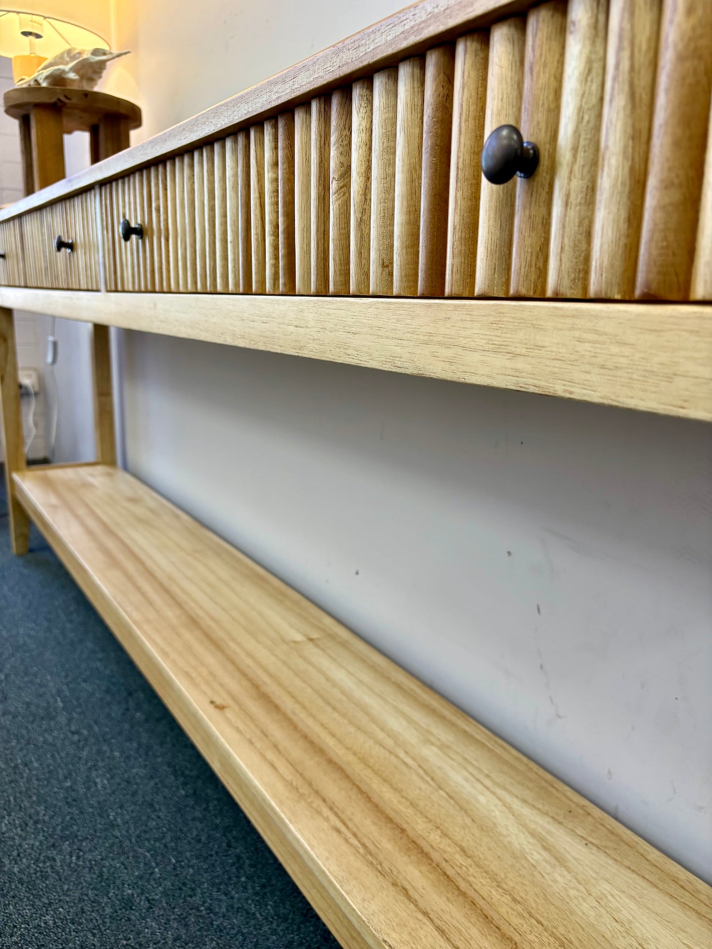 The Vienna - 2 Drawer Natural 1500 Console, natural, brings a contemporary feel with its sleek design and textured drawer face. Built with sustainable white cedar its 2 drawers sit on wooden runners. Colour natural. Measures 1500 length X 250 depth X 750 height. Angle.