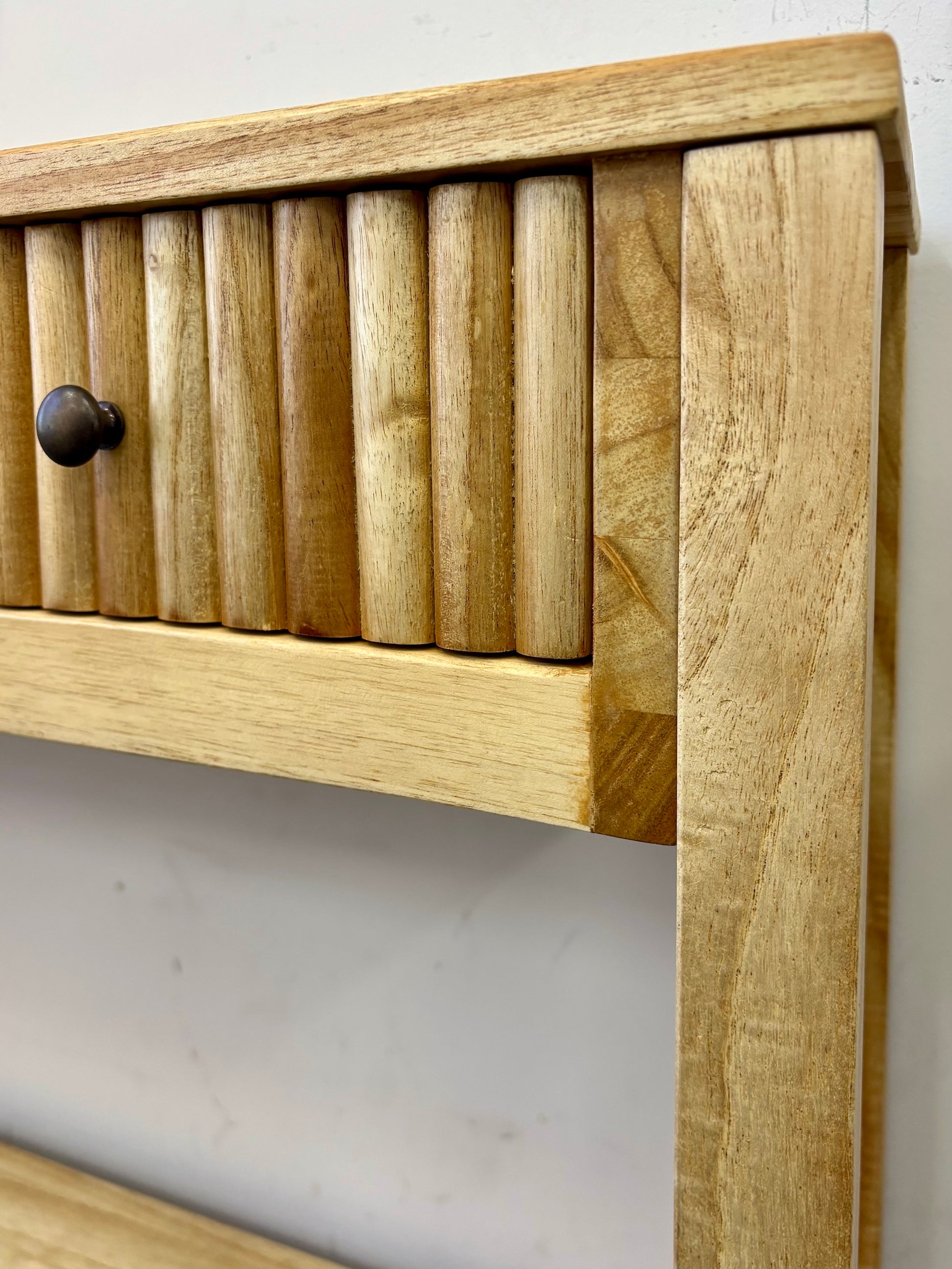 The Vienna - 2 Drawer Natural 1500 Console, natural, brings a contemporary feel with its sleek design and textured drawer face. Built with sustainable white cedar its 2 drawers sit on wooden runners. Colour natural. Measures 1500 length X 250 depth X 750 height. Close.