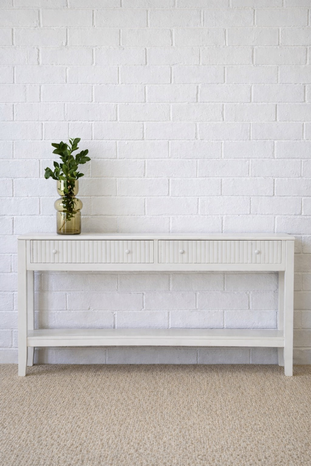 The Vienna - 2 Drawer White Console, natural, brings a contemporary feel with its sleek design and textured drawer face. Built with sustainable white cedar its 2 drawers sit on wooden runners. Colour white. Measures 1500 length X 250 depth X 750 height. Styled.