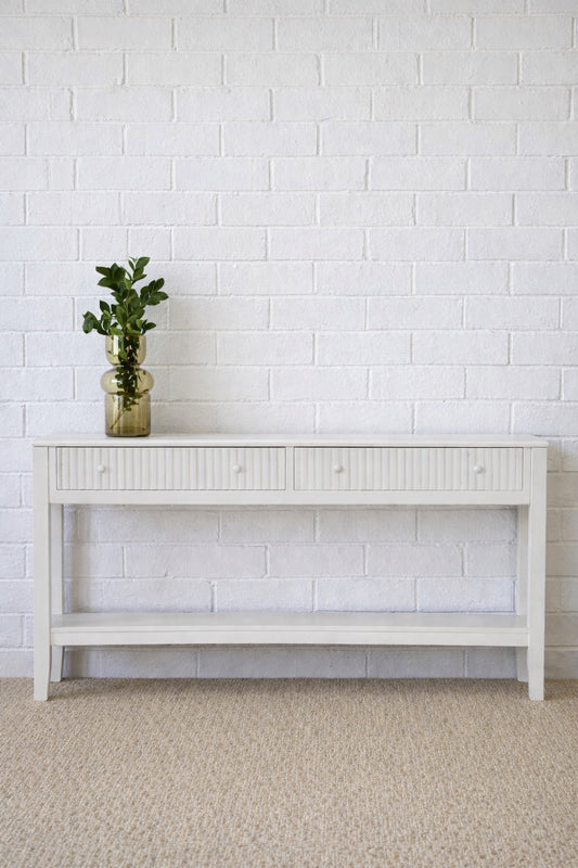 The Vienna - 2 Drawer White Console, natural, brings a contemporary feel with its sleek design and textured drawer face. Built with sustainable white cedar its 2 drawers sit on wooden runners. Colour white. Measures 1500 length X 250 depth X 750 height. Styled.
