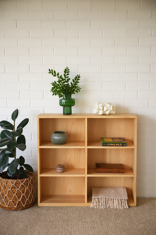The Virgo Bookshelf Medium. 6 compartments of storage in a 3 x 2 configuration. Constructed from solid white cedar. Colour Natural. Measures 1280 Height x 1200 Wide x 350 Depth. Styled.