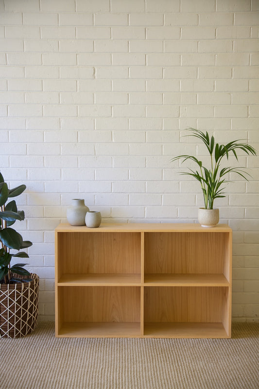 The Virgo Bookshelf Small. 4 compartments of storage in a 2 x 2 configuration. Constructed from solid white cedar. Colour Natural. Measures 8600 Height x 1200 Wide x 350 Depth. Styled.