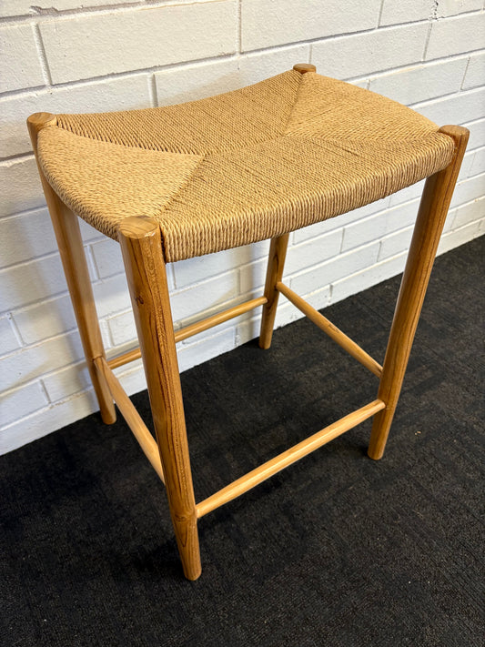 Wenatchee barstool with solid teak wood frame and hand-woven natural rope seat, featuring a clean, minimalist design suitable for coastal and contemporary interiors. Measures 500 Width X 340 Depth X 660 Height. Angle.