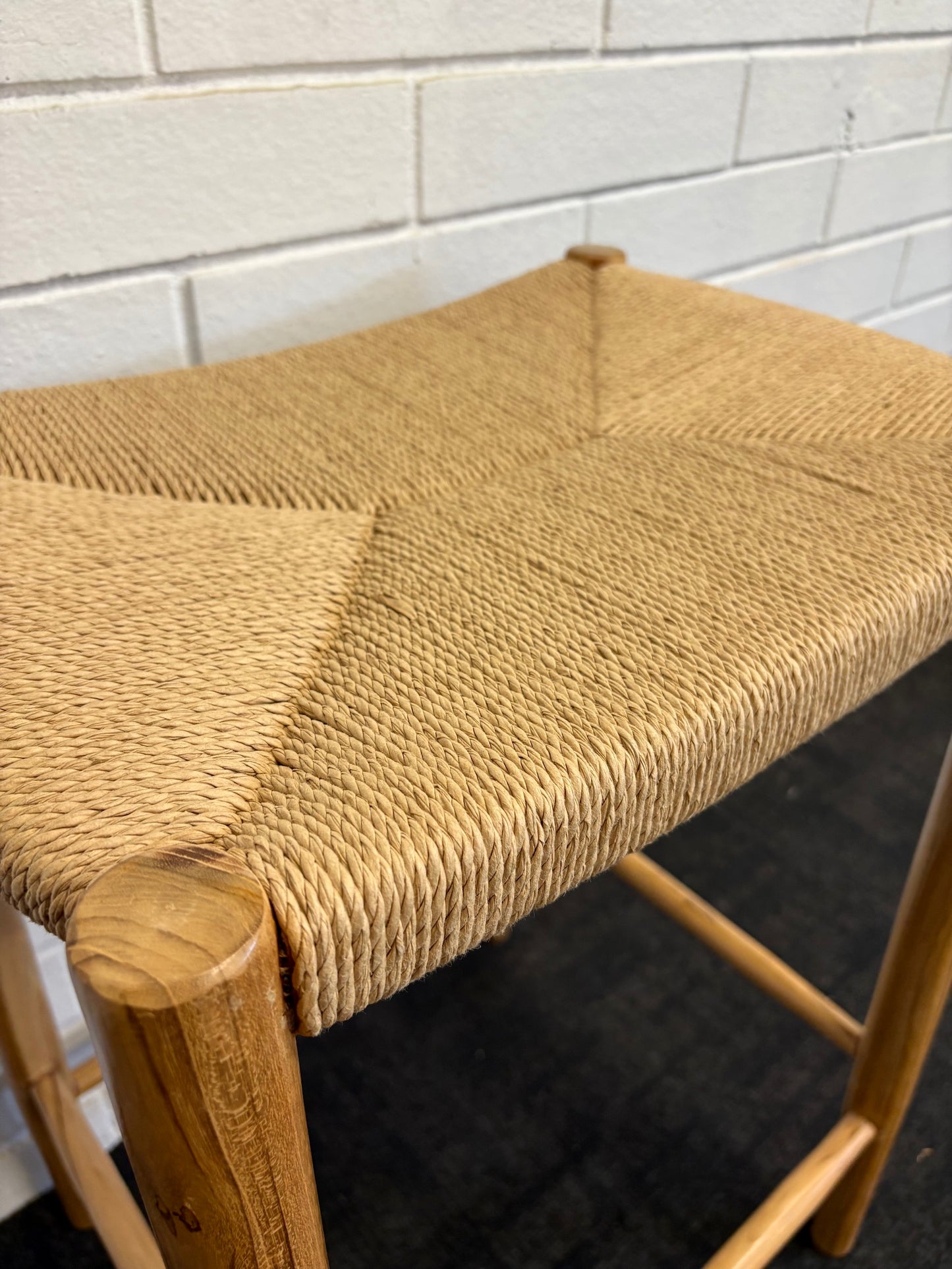 Wenatchee barstool with solid teak wood frame and hand-woven natural rope seat, featuring a clean, minimalist design suitable for coastal and contemporary interiors. Measures 500 Width X 340 Depth X 660 Height. Close.