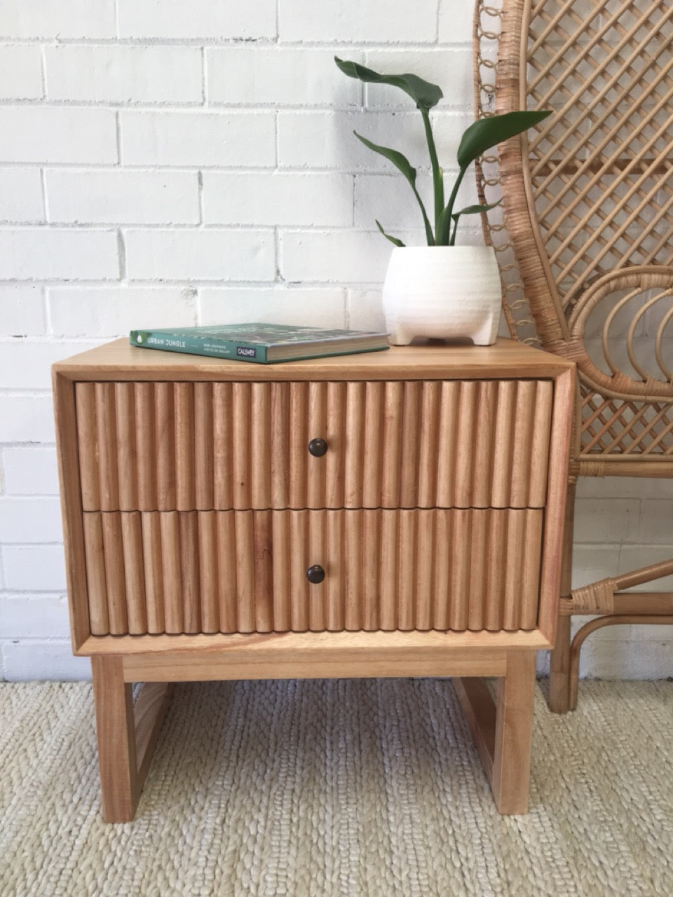 The Whistler 2 Drawer Bedside is crafted from sustainable white cedar and features two drawers, on wood runners, with a stylish textured drawer cover. Colour natural. Measures 600 wide X 350 depth X 600 height. Front Styled.