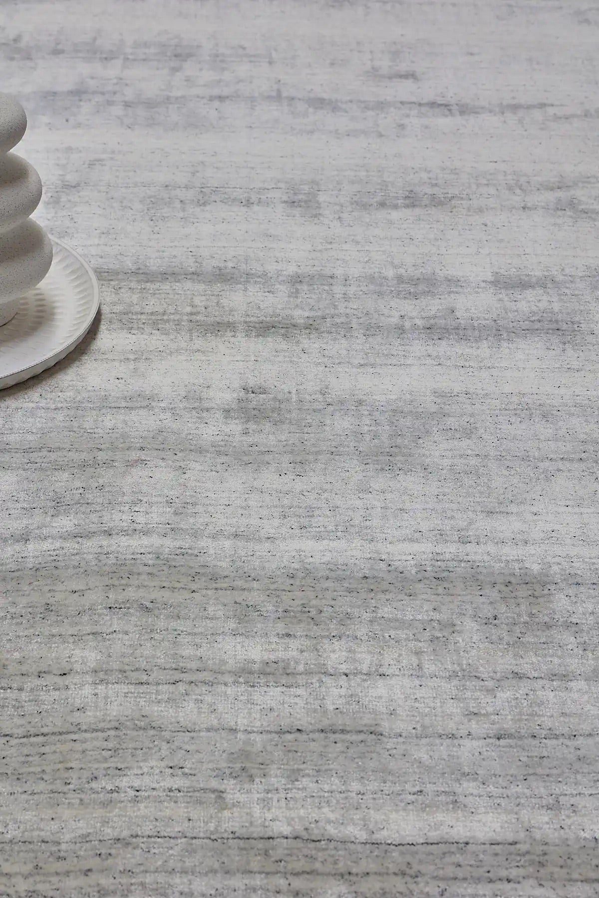 Close view of a Wool Hand Woven pile rug in neutral tones.