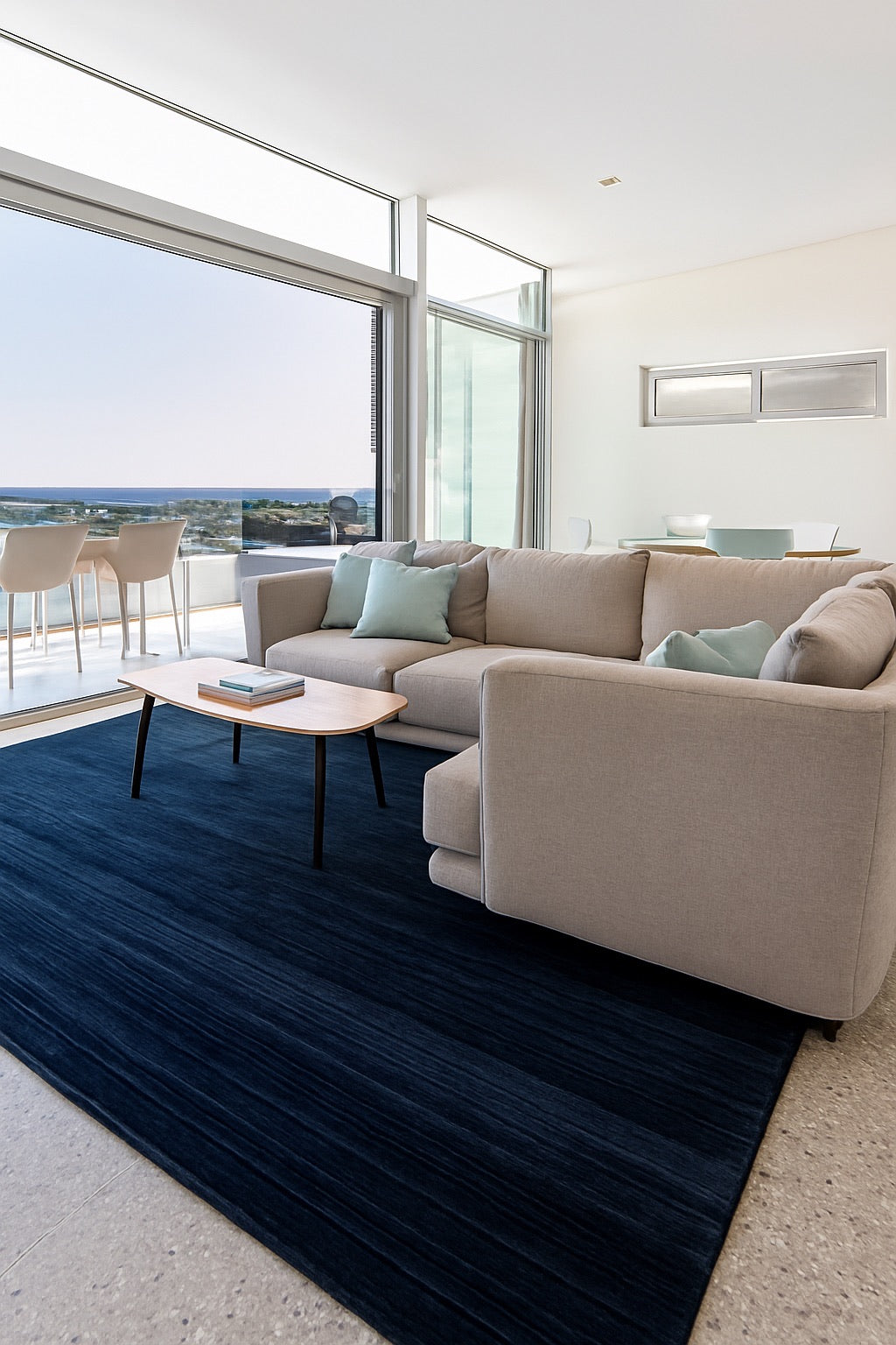 A Wool hand woven pile rug styled in a coastal Perth home living room setting.