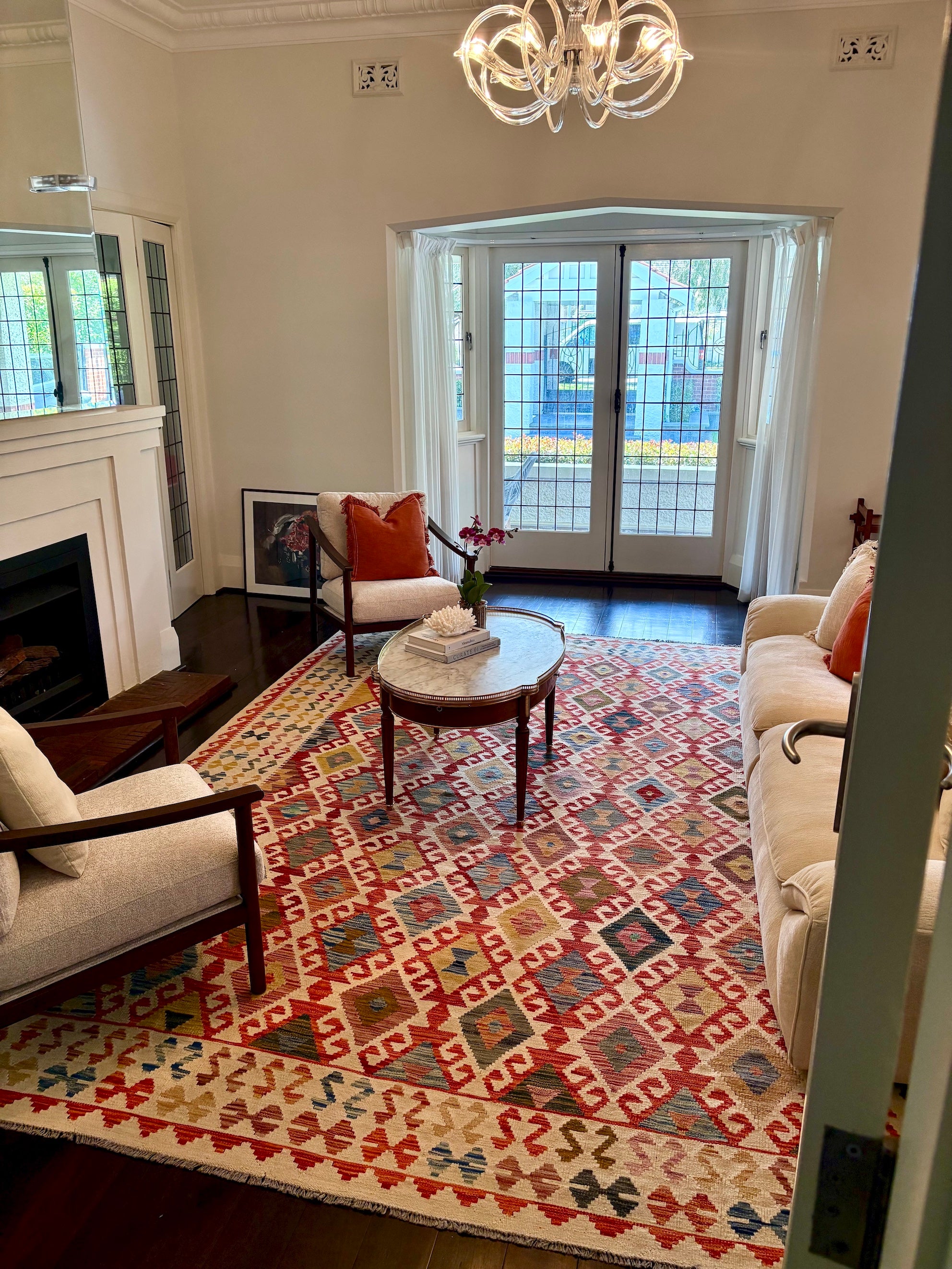 A Wool hand-woven khyber kilim rug styled in a heritage Perth home living room setting.
