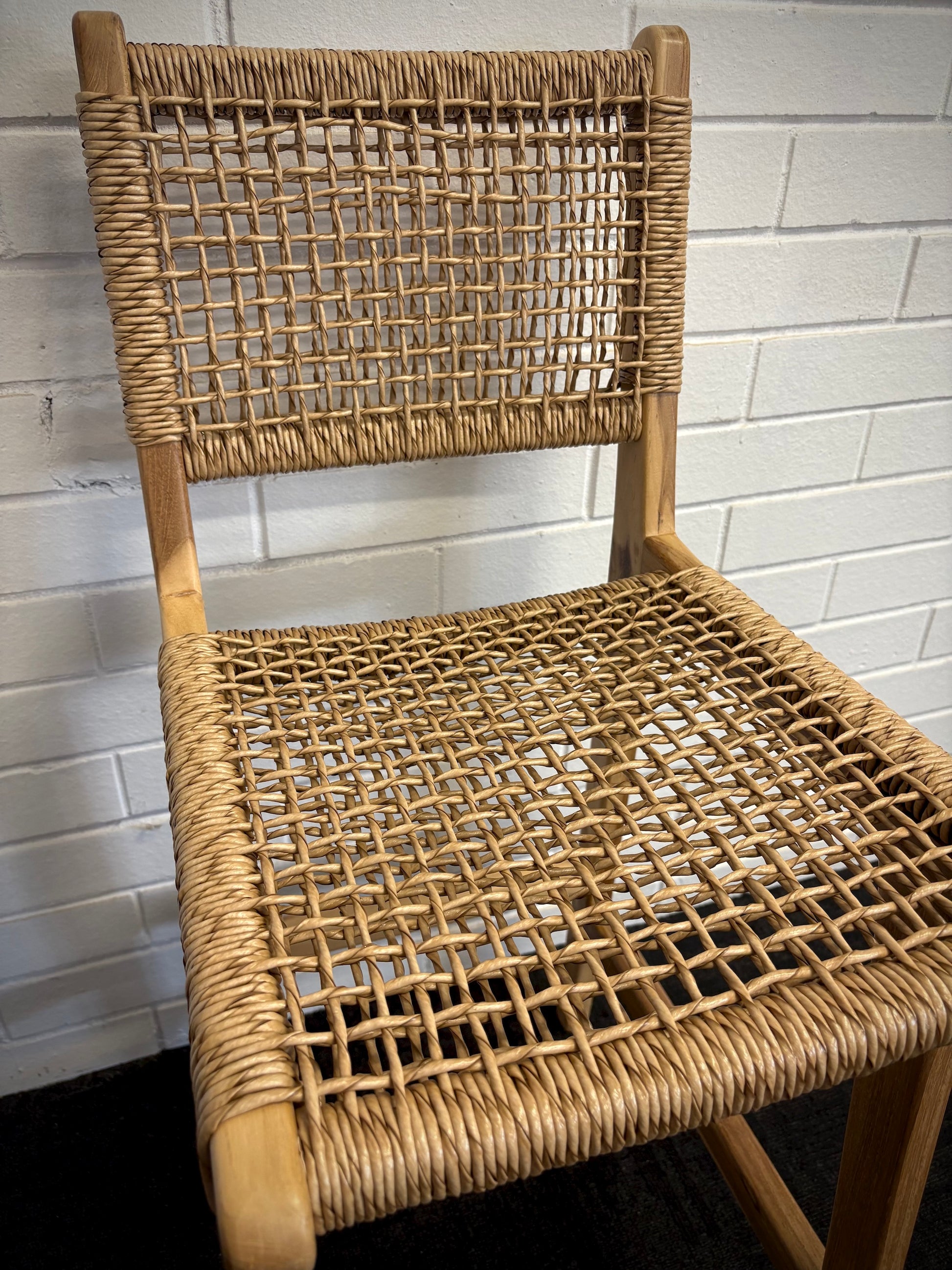 The Yakima with Back Barstool boasts a coastal contemporary feel. Crafted from sustainable solid teak and featuring a luxurious synthetic rope seat and back. Colour natural. Measures 400 wide X 500 depth X 670 seat height. Back height 1020. Close.