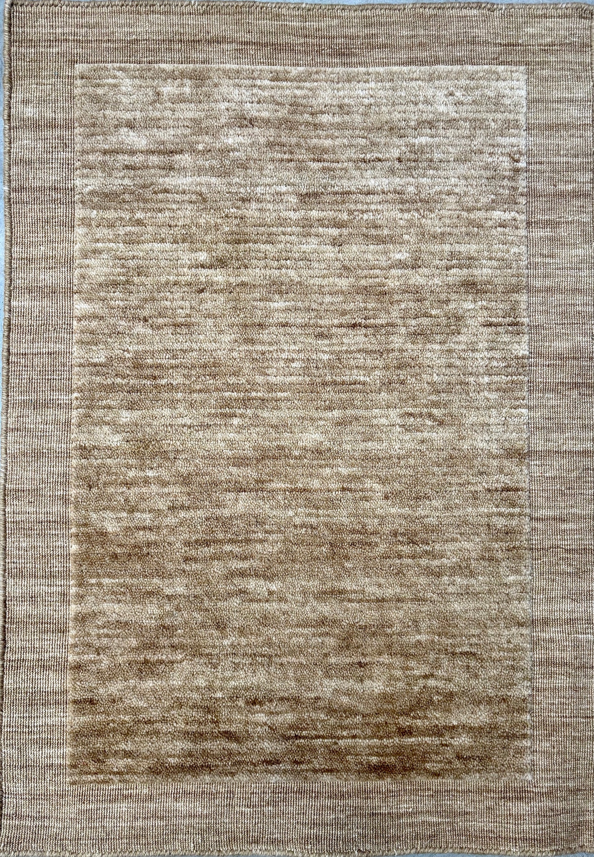 Yarra Camel piled hand-woven wool rug in a warm honeyed neutral tone with a low channeled pile and flat woven border. Available in 4 sizes. Top View.