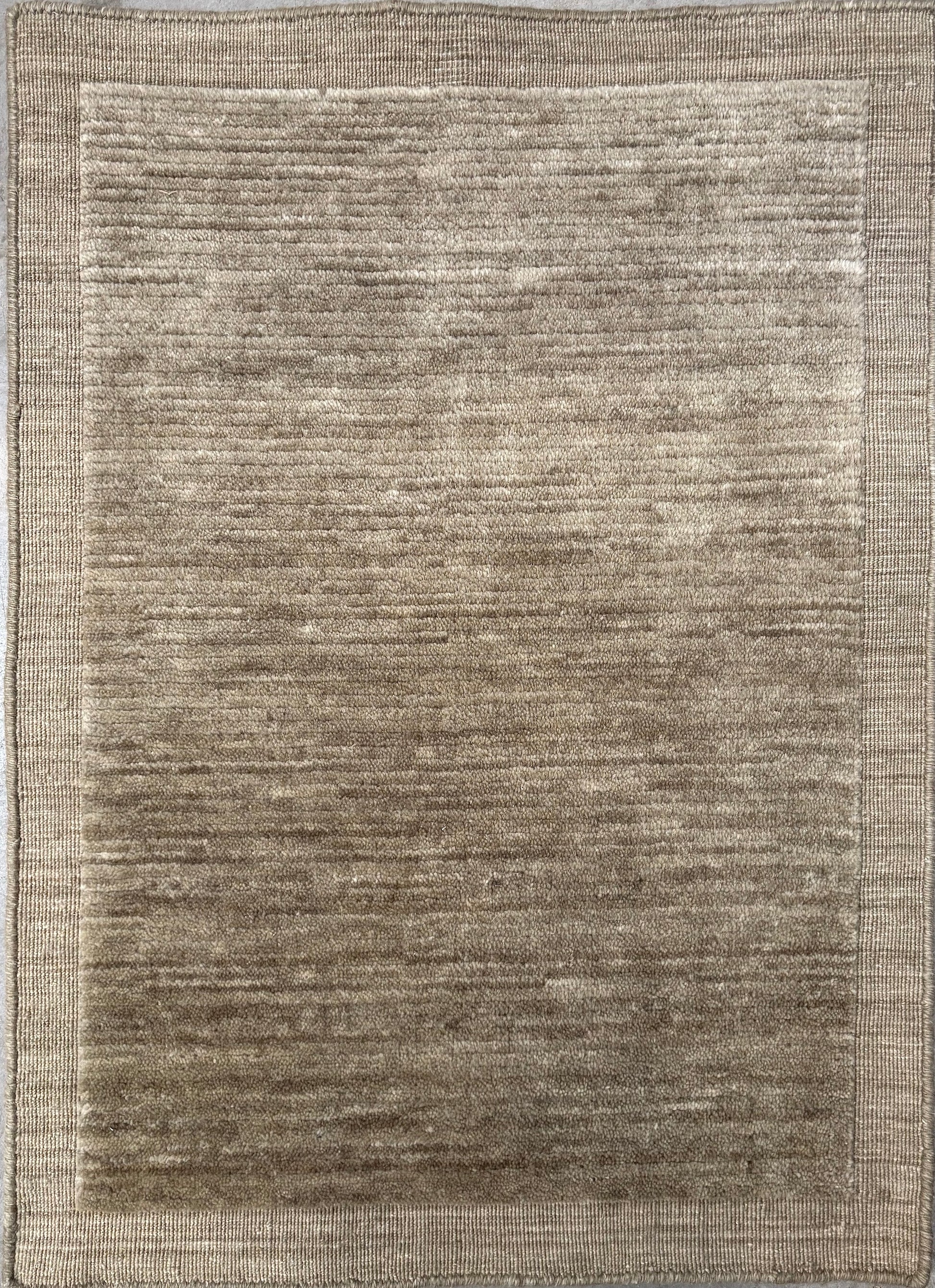 Yarra Moss piled hand-woven wool rug in a muted earthy green with a low channeled pile and flat woven border. Available in 4 sizes. Top View.