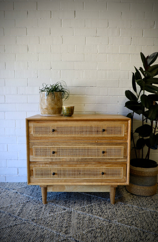 The Yosemite 3 Drawer chest features a solid white cedar frame and drawers.  Open mesh rattan drawer face with drawers on wooden runners. stylish turned legs. Measures 850W x 450D x 750H. Front Styled.