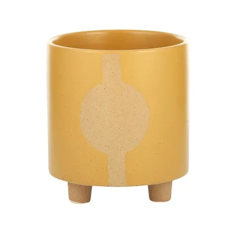 The Zod Ceramic Pot - Small, is a modern simplistic designed planter pot.  Its smooth texture and round feet add a modern feel. Colour Orange. Size 14 diameter x 15.5 height. Front Plain.