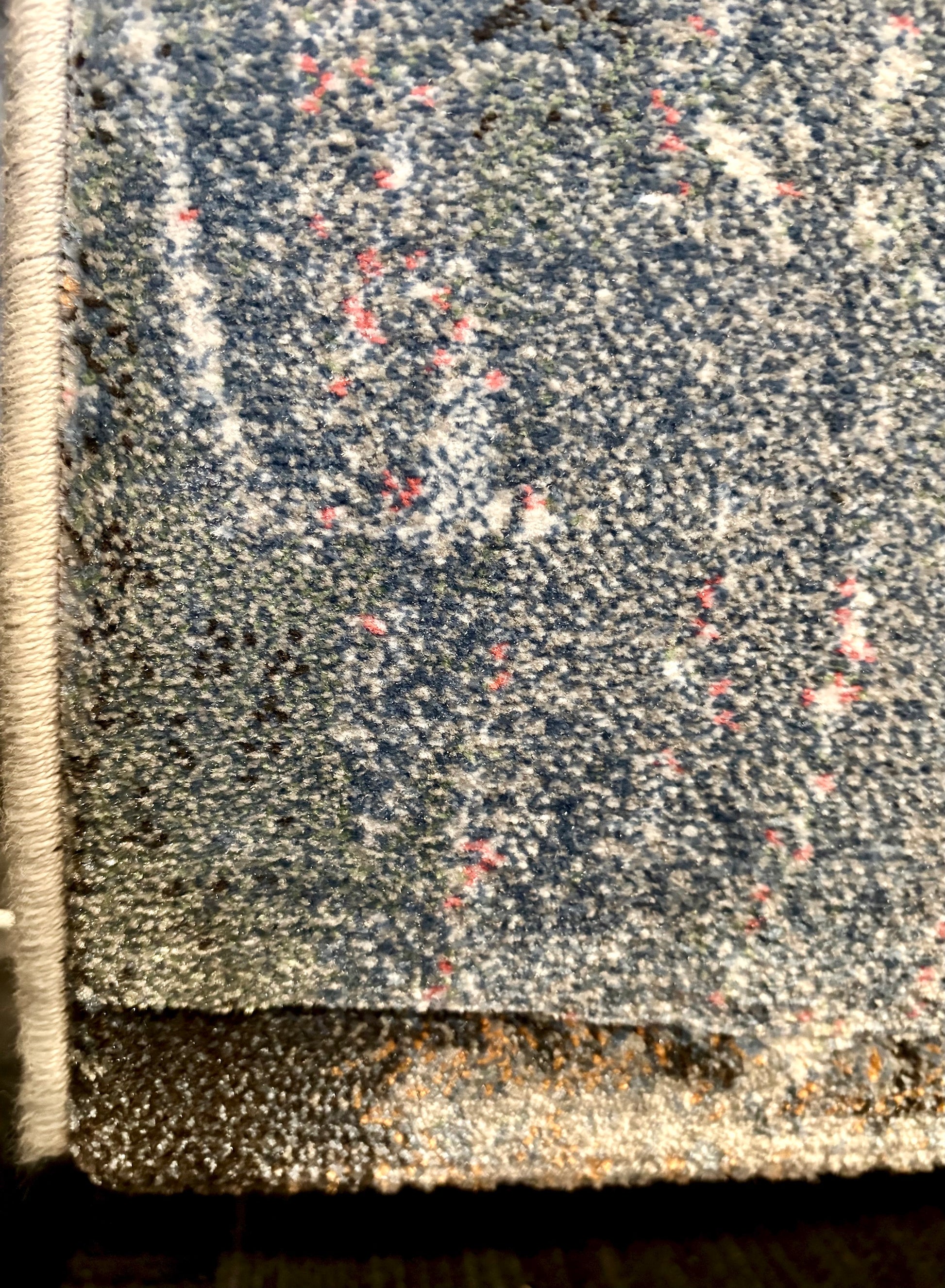 The Zenith Flux rug. Skilfully crafted from durable heat-set polypropylene, this rug features a chic contemporary design. Colours, greys, white, beige, blues. 3 Sizes. Corner.