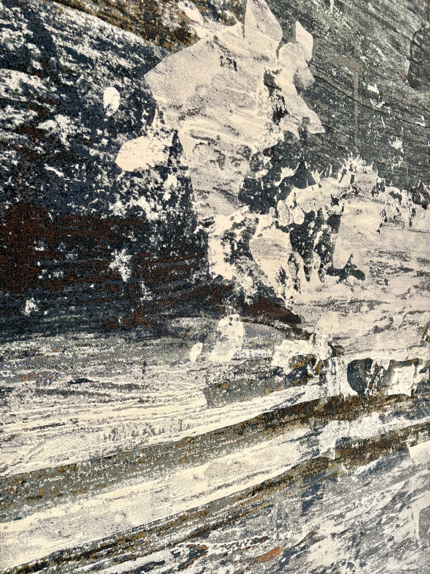 The Zenith Strata rug. This rug is skilfully created from strong heat-set polypropylene, showcasing a stylish contemporary design. Colours, whites, greys, blues, beiges. Close Angle.