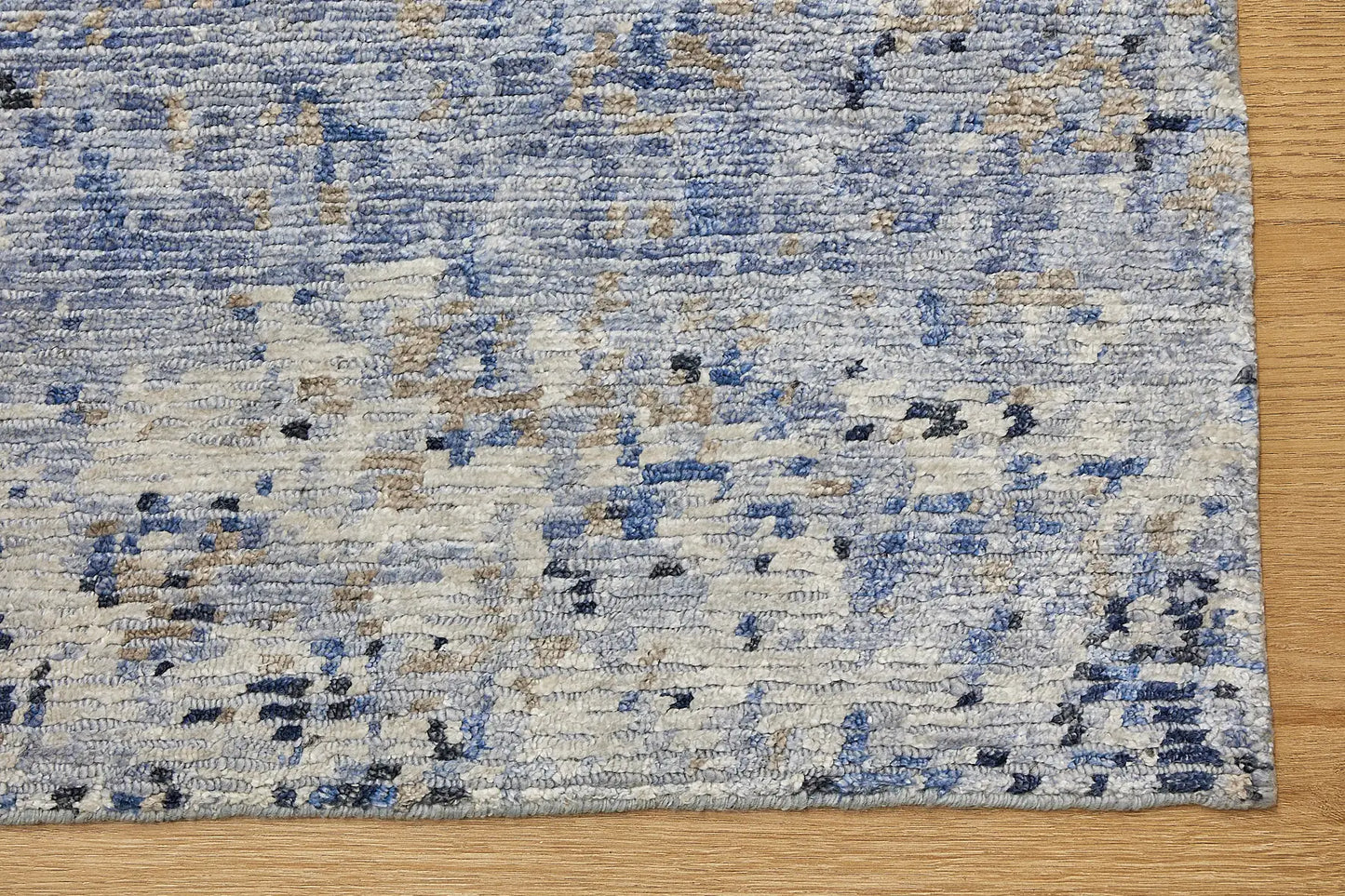 Zurich Blue is a luxurious contemporary/modern designed rug.  Hand Knotted from a blend of wool and bamboo Silk. Colours Blues, whites, and greys. Sizes 200 X 290, 250 X 300 and 270 X 360. Corner.