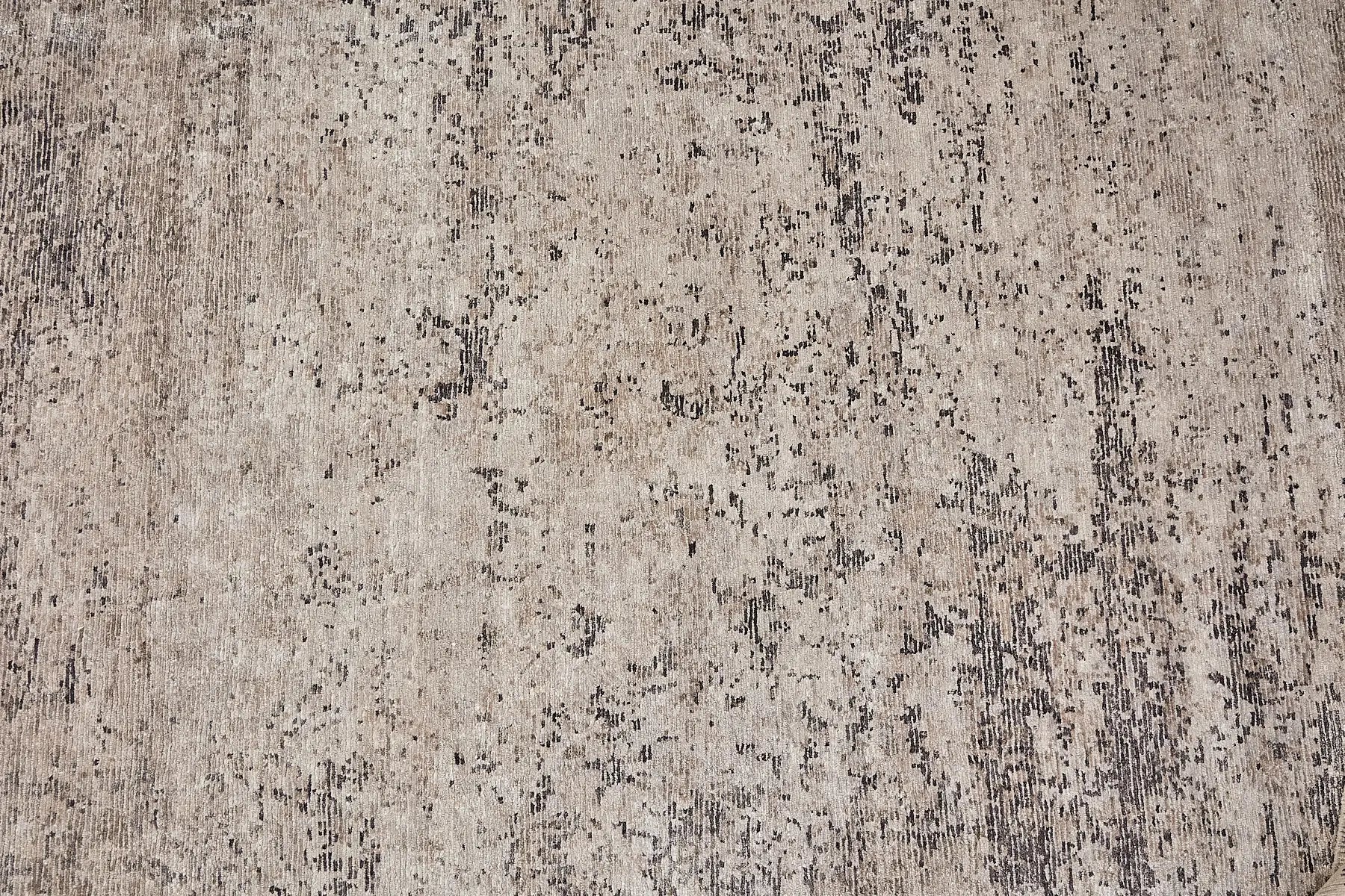 Zurich Grey is a luxurious contemporary/modern designed rug.  Hand Knotted from a blend of wool and bamboo Silk. Colours Light Grey, Dark Grey, and Grey. Sizes 200 X 290, 250 X 300 and 270 X 360. Full.
