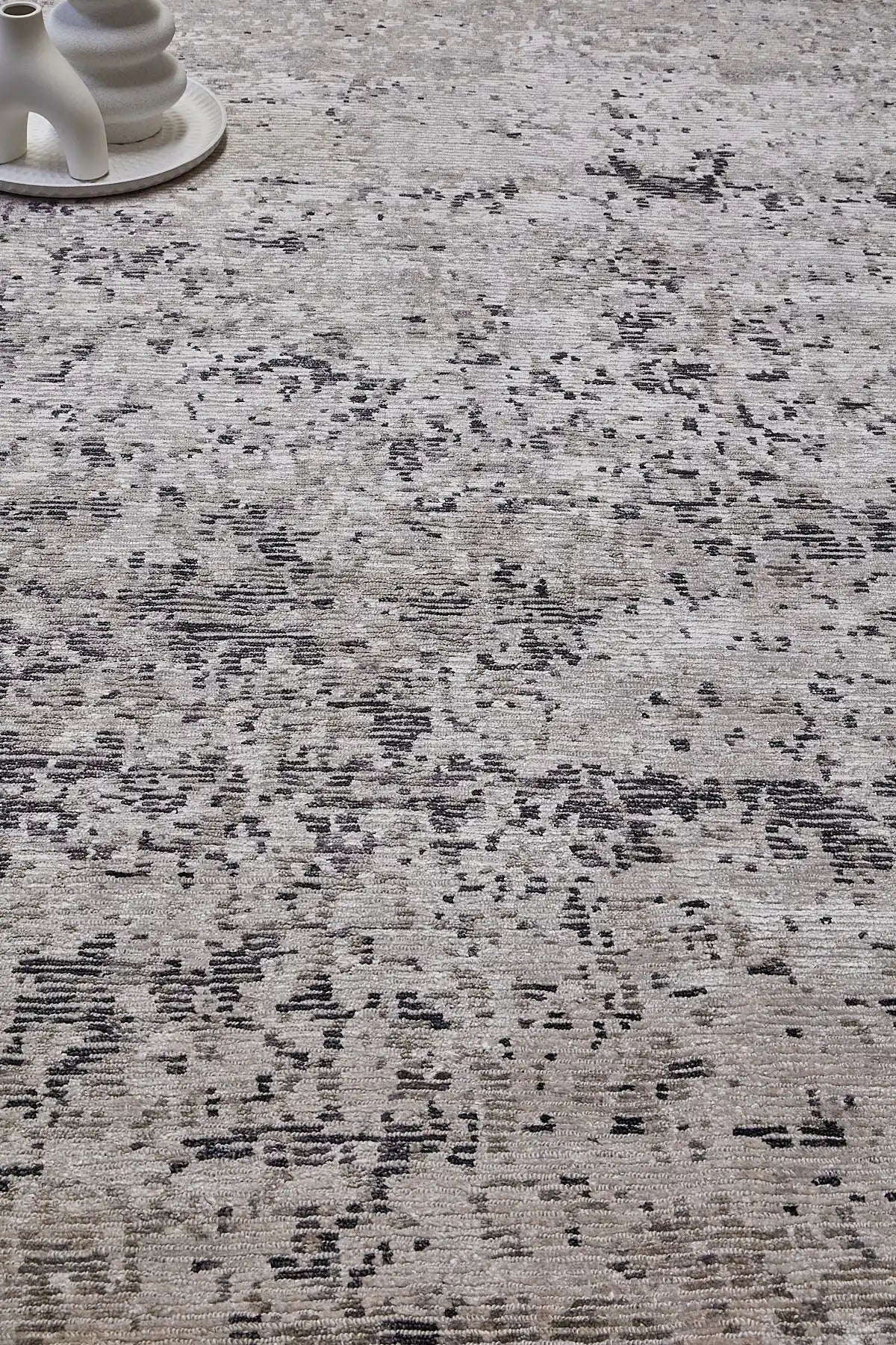 Zurich Grey is a luxurious contemporary/modern designed rug.  Hand Knotted from a blend of wool and bamboo Silk. Colours Light Grey, Dark Grey, and Grey. Sizes 200 X 290, 250 X 300 and 270 X 360. Life.