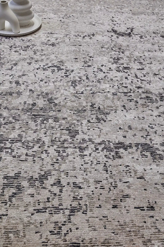 Zurich Grey is a luxurious contemporary/modern designed rug.  Hand Knotted from a blend of wool and bamboo Silk. Colours Light Grey, Dark Grey, and Grey. Sizes 200 X 290, 250 X 300 and 270 X 360. Life.