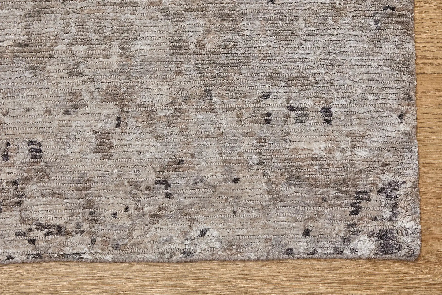 Zurich Smoke is a luxurious contemporary/modern designed rug.  Hand Knotted from a blend of wool and bamboo Silk. Colours Dark Grey, Grey, and Light Greys. Sizes 200 X 290, 250 X 300 and 270 X 360. Corner.