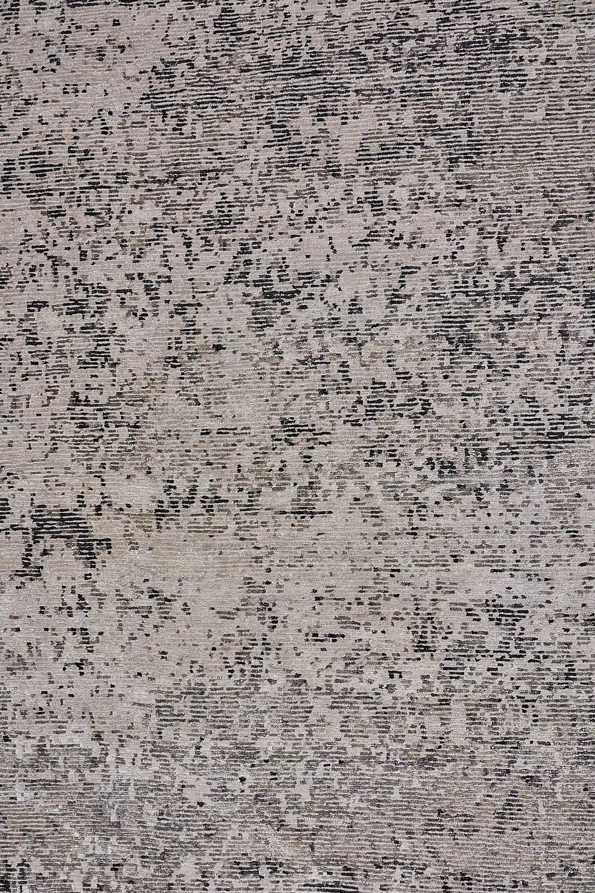 Zurich Smoke is a luxurious contemporary/modern designed rug.  Hand Knotted from a blend of wool and bamboo Silk. Colours Dark Grey, Grey, and Light Greys. Sizes 200 X 290, 250 X 300 and 270 X 360. Full.
