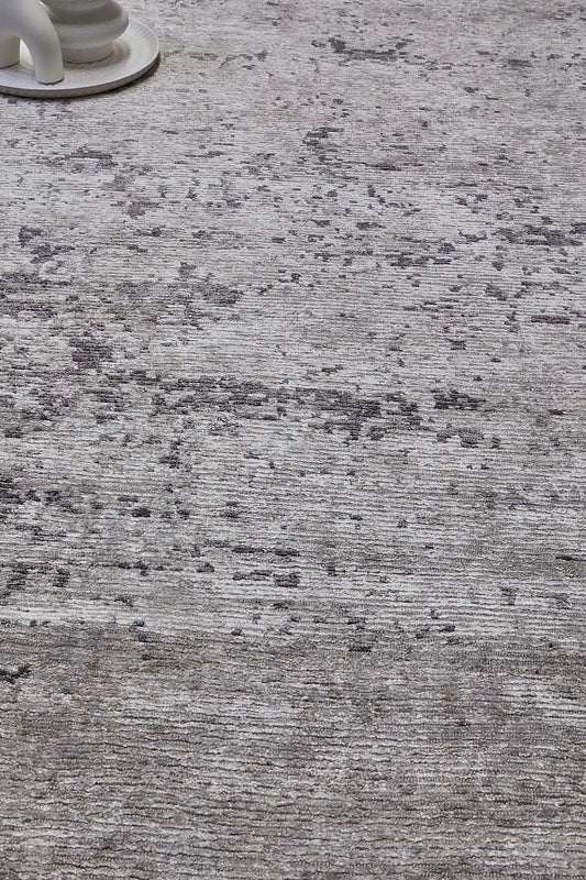 Zurich Smoke is a luxurious contemporary/modern designed rug.  Hand Knotted from a blend of wool and bamboo Silk. Colours Dark Grey, Grey, and Light Greys. Sizes 200 X 290, 250 X 300 and 270 X 360. Life.