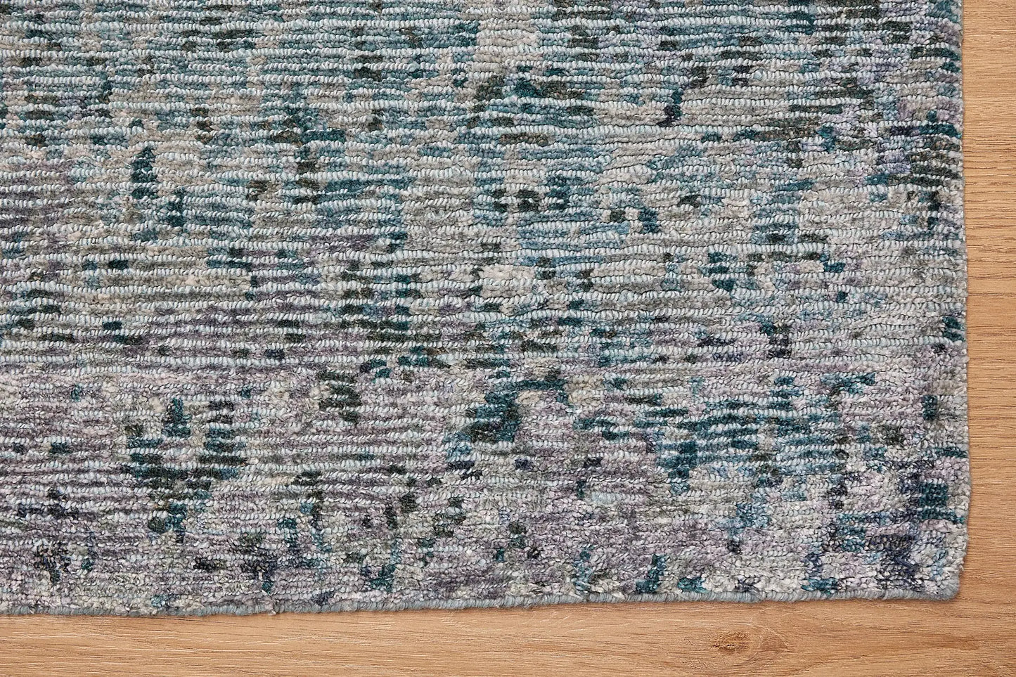 Zurich Teal is a luxurious contemporary/modern designed rug.  Hand Knotted from a blend of wool and bamboo Silk. Colours Teal Green, Light Grey, and Grey. Sizes 200 X 290, 250 X 300 and 270 X 360. Corner.