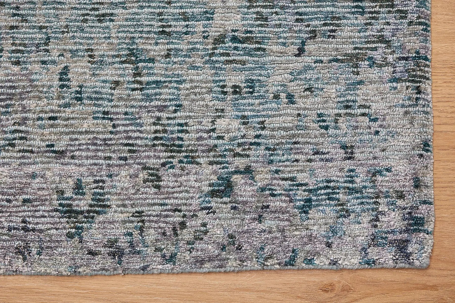 Zurich Teal is a luxurious contemporary/modern designed rug.  Hand Knotted from a blend of wool and bamboo Silk. Colours Teal Green, Light Grey, and Grey. Sizes 200 X 290, 250 X 300 and 270 X 360. Corner.