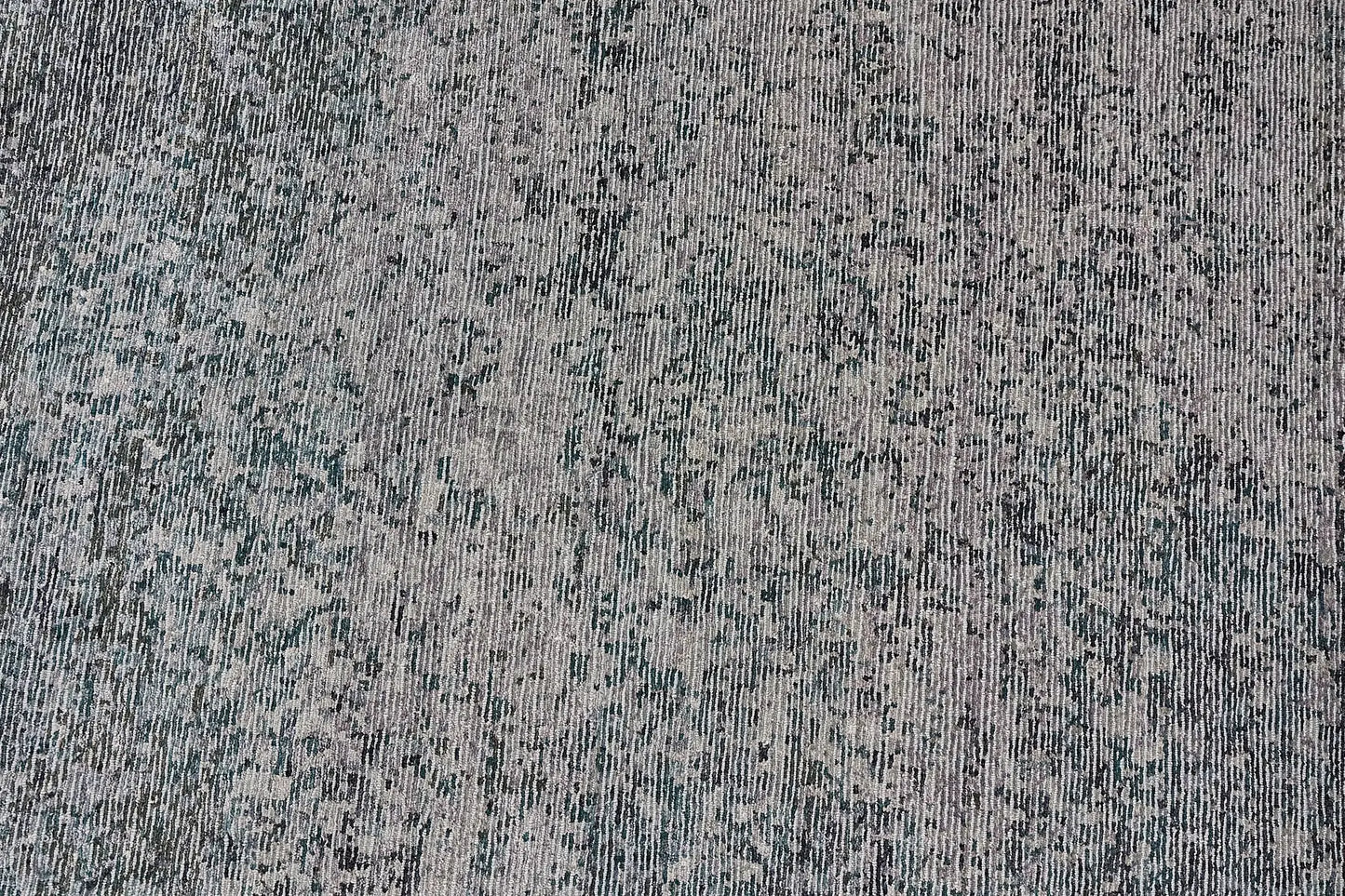 Zurich Teal is a luxurious contemporary/modern designed rug.  Hand Knotted from a blend of wool and bamboo Silk. Colours Teal Green, Light Grey, and Grey. Sizes 200 X 290, 250 X 300 and 270 X 360. Full.