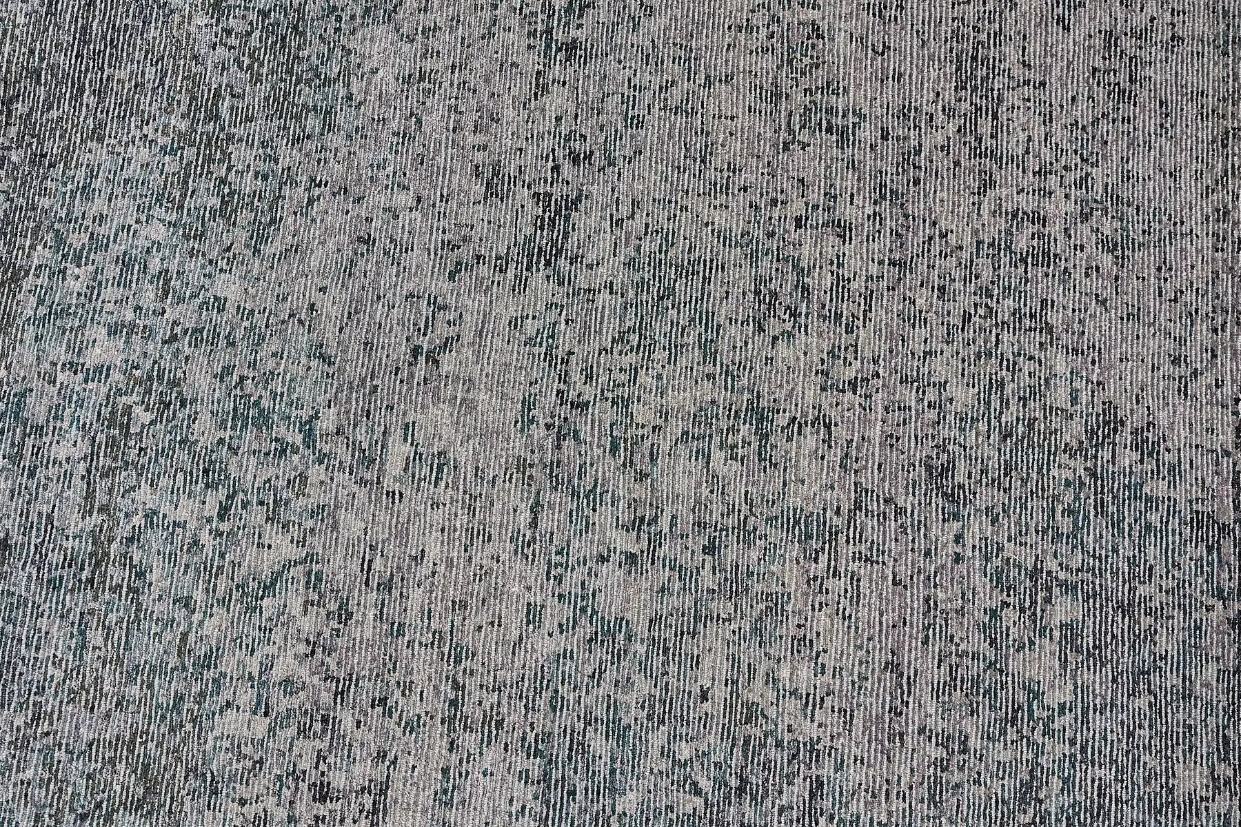 Zurich Teal is a luxurious contemporary/modern designed rug.  Hand Knotted from a blend of wool and bamboo Silk. Colours Teal Green, Light Grey, and Grey. Sizes 200 X 290, 250 X 300 and 270 X 360. Full.