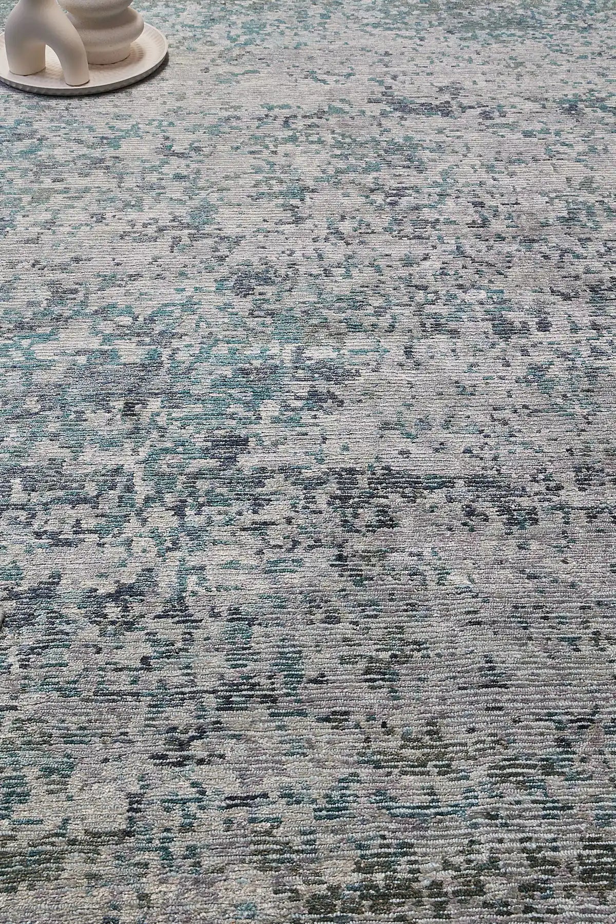 Zurich Teal is a luxurious contemporary/modern designed rug.  Hand Knotted from a blend of wool and bamboo Silk. Colours Teal Green, Light Grey, and Grey. Sizes 200 X 290, 250 X 300 and 270 X 360. Life.