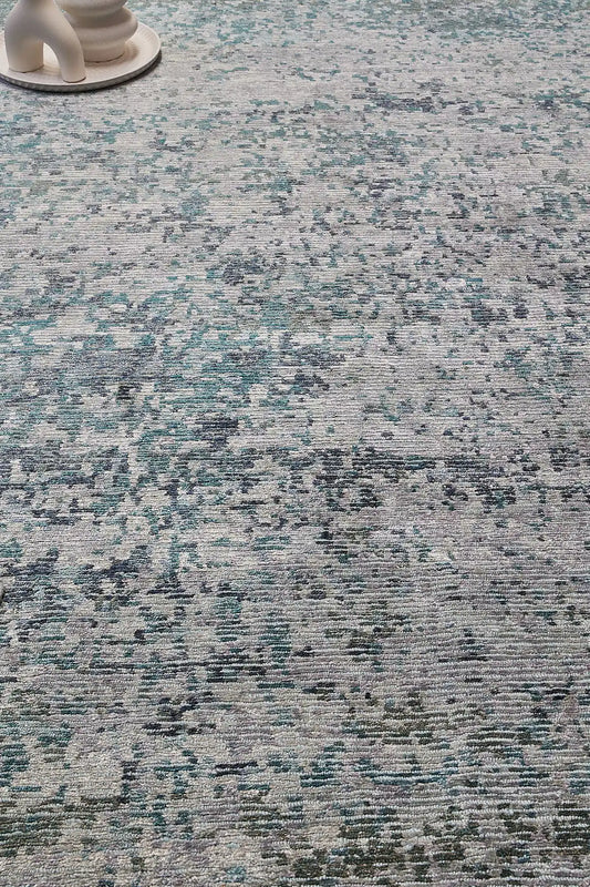 Zurich Teal is a luxurious contemporary/modern designed rug.  Hand Knotted from a blend of wool and bamboo Silk. Colours Teal Green, Light Grey, and Grey. Sizes 200 X 290, 250 X 300 and 270 X 360. Life.