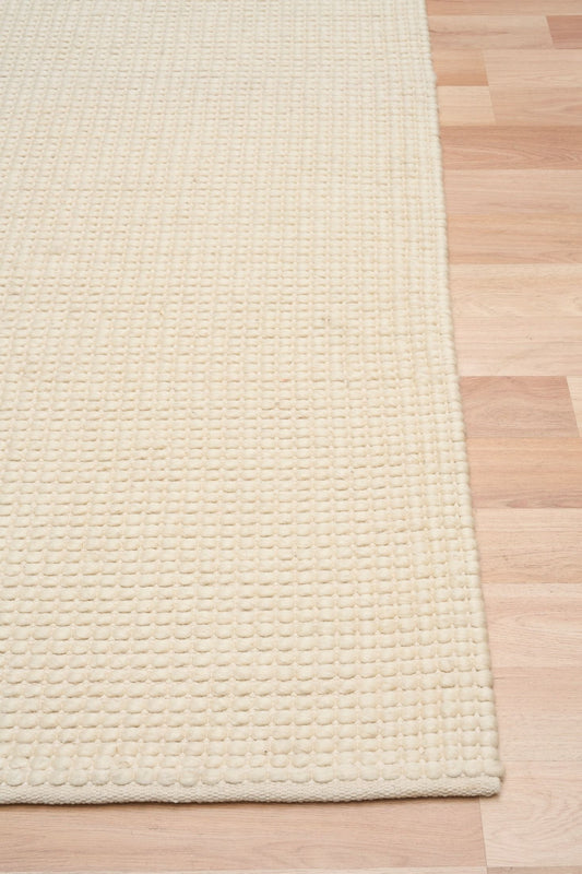 Dasha Runner - Cream is a texture hand woven rug runner made of 80%  New Zealand Wool and 20% Polyester. Colour Beige. Size 80 X 320. Front.