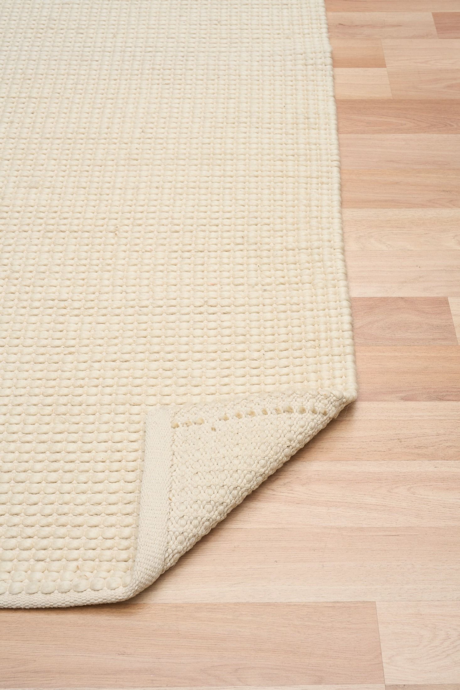 Dasha Runner - Cream is a texture hand woven rug runner made of 80%  New Zealand Wool and 20% Polyester. Colour Beige. Size 80 X 320. Fold.
